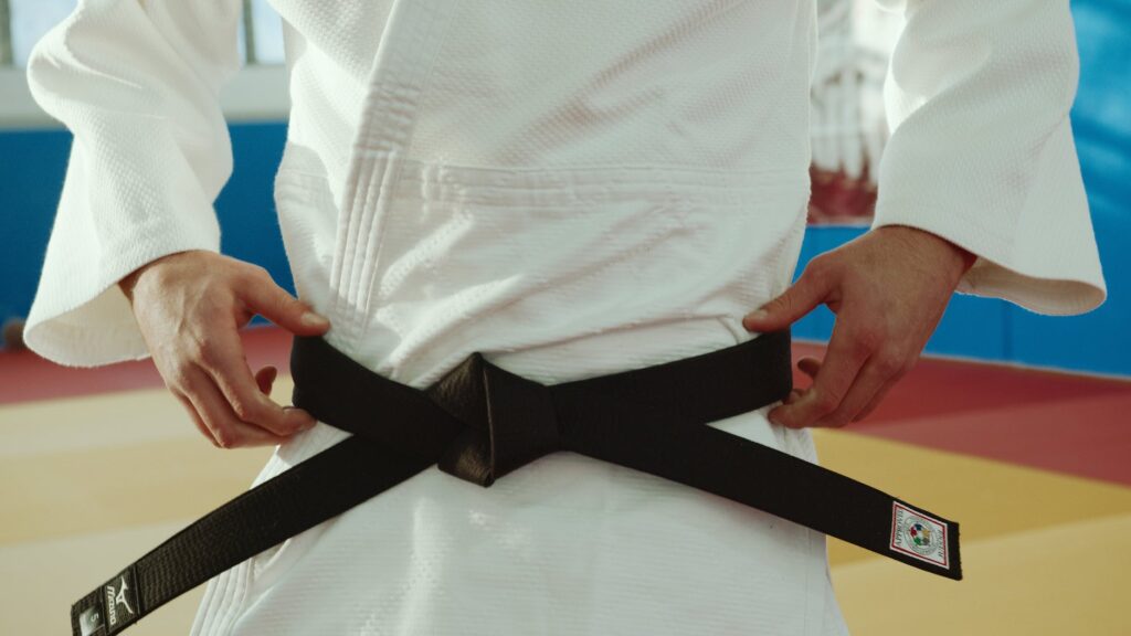 close up shot of a person wearing a black belt