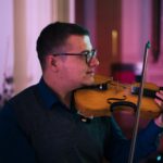man holding violin