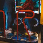 two people on a dance arcade machine